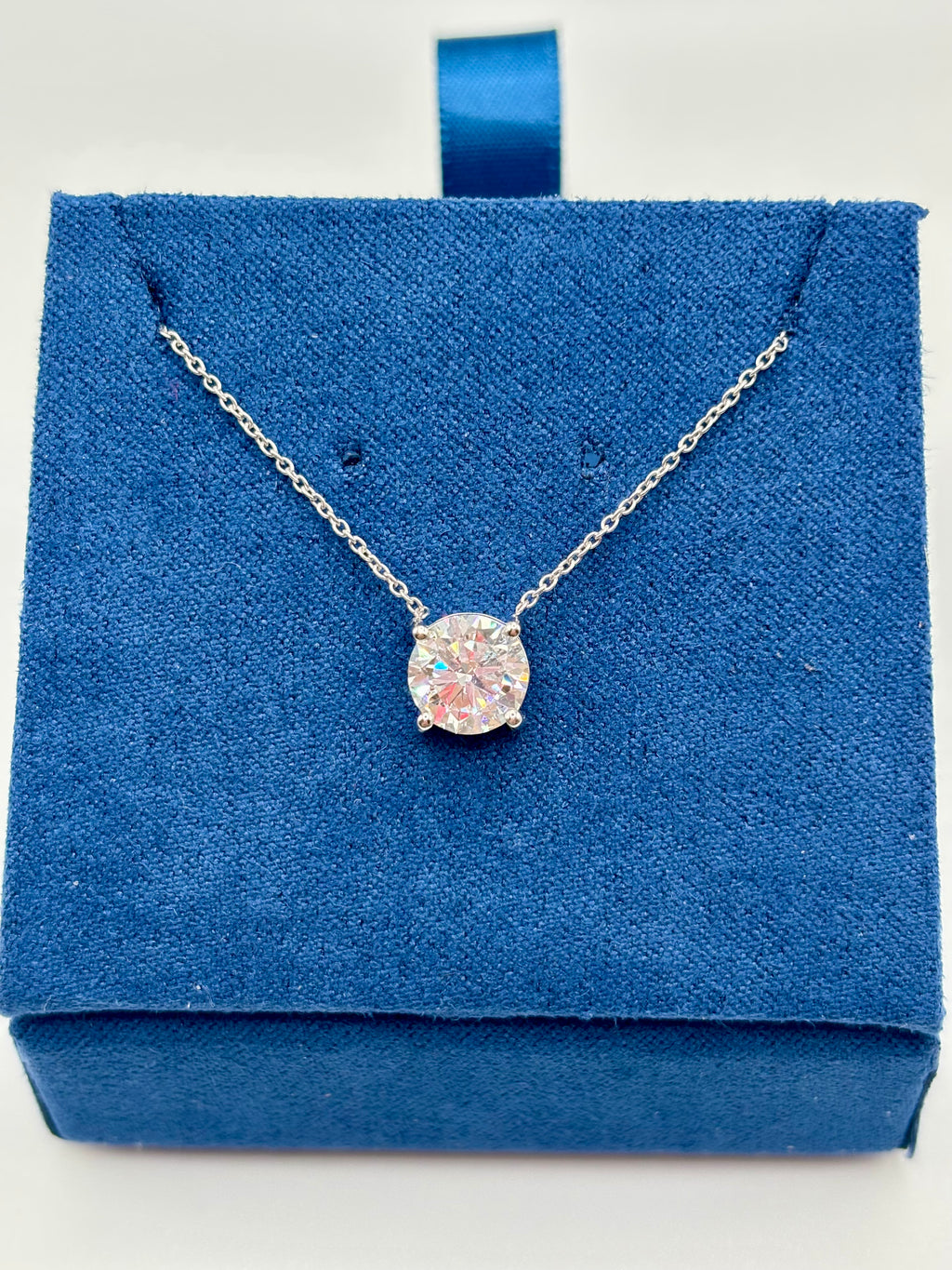 1.5ct lab diamond station necklace in 14K white gold, front view on blue velvet box
