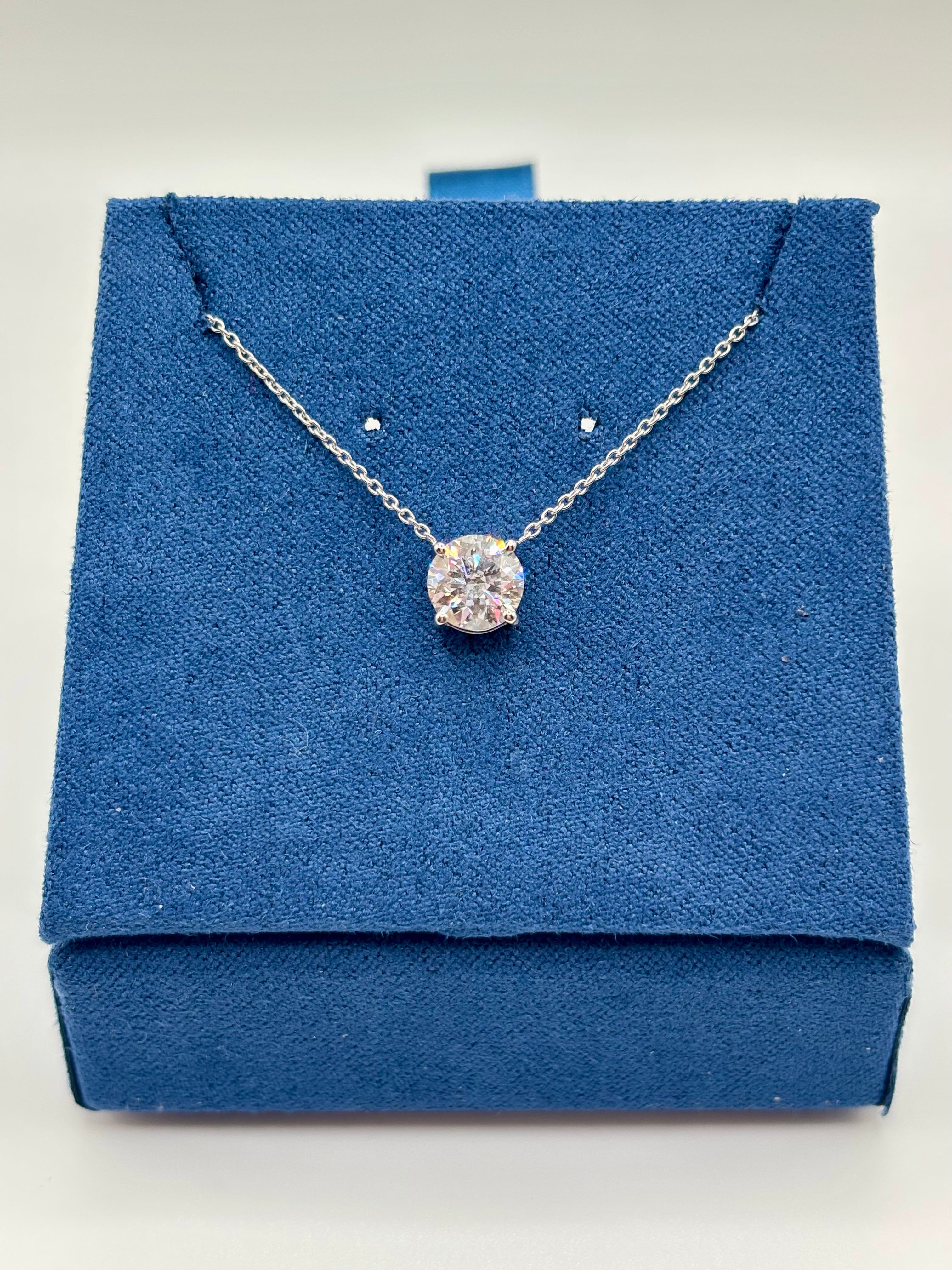 Lab diamond solitaire necklace in 14K white gold displayed on blue velvet box, full view