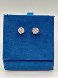 2 CTW lab diamond solitaire stud earrings in 14K white gold on blue velvet box, top view