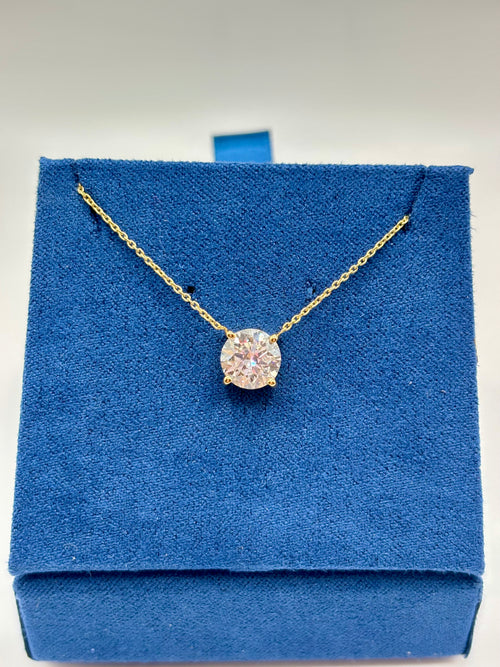 1.5 carat pink lab diamond solitaire station necklace in 14K yellow gold on blue velvet box, front view
