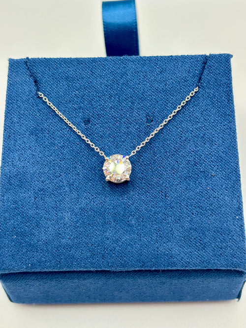 1.5 carat lab diamond solitaire station necklace in 14K white gold on blue velvet box, top view