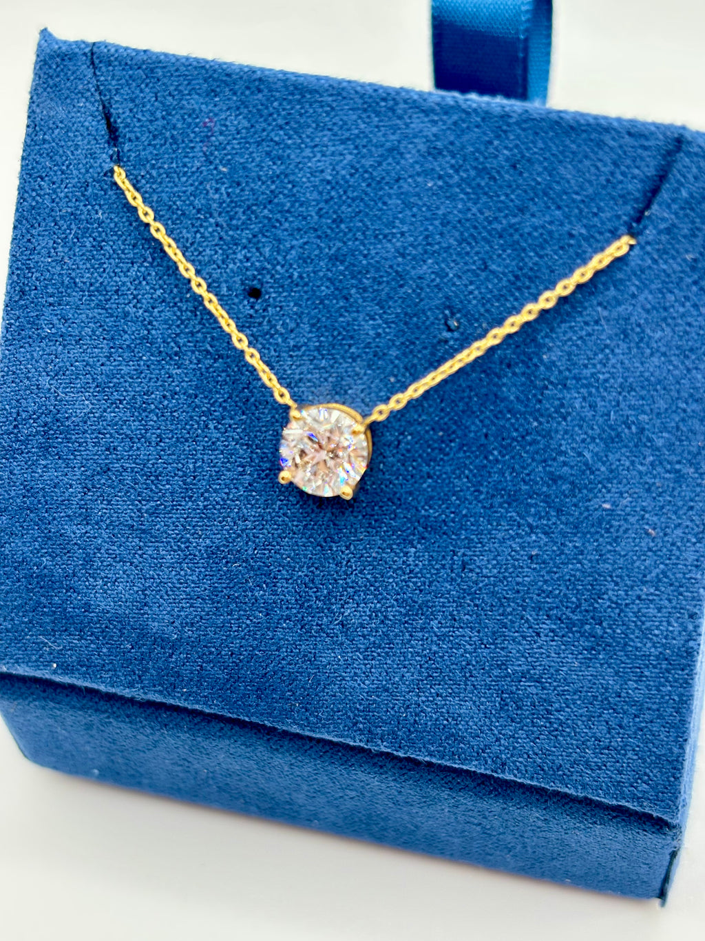 Close-up of 1ct lab diamond solitaire pendant in four-prong setting