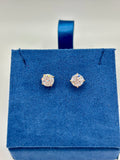 2 CTW lab diamond solitaire stud earrings in 14K yellow gold on blue velvet box, top view